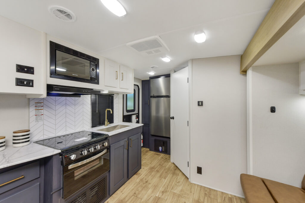 Interior view of the dining area in a 2024 Mallard MA 210RB travel trailer by Heartland RVs.