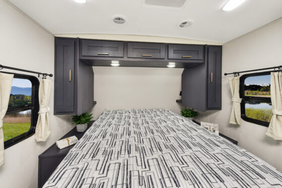 Interior view of the bedroom area in a 2024 Mallard MA 210RB travel trailer by Heartland RVs.