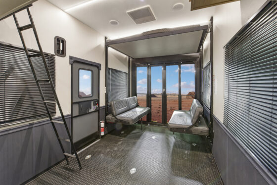 The garage and hangout area of the 2025 Heartland Cyclone 4215, featuring ample space, comfortable seating, and a versatile layout.