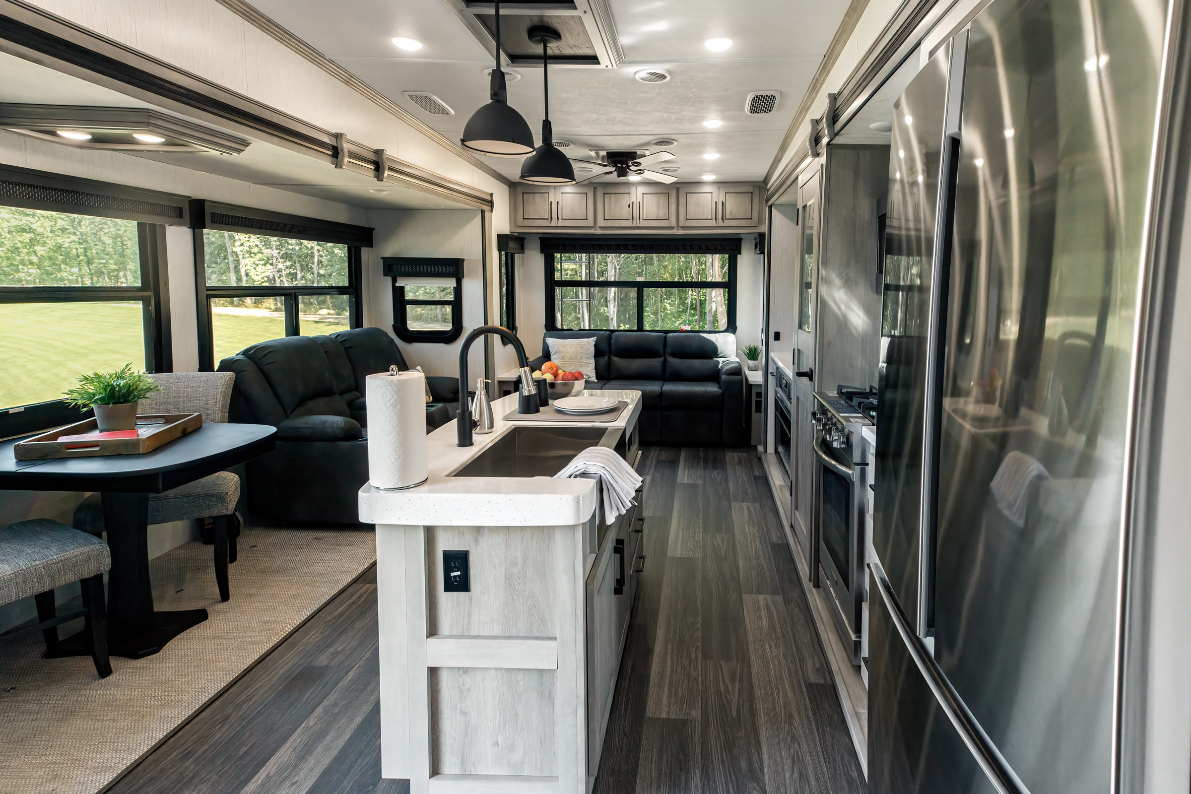 The interior of the Big Country RV, showing the kitchen and living room areas.