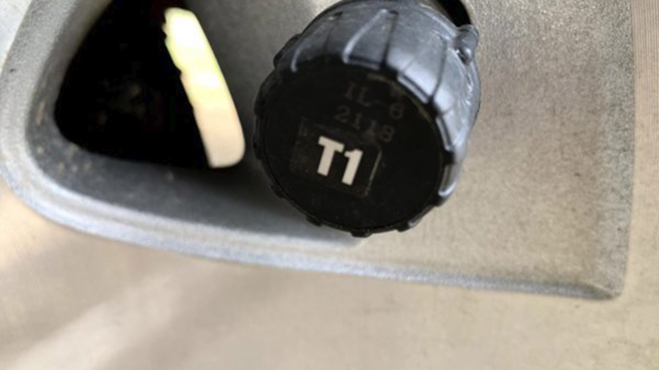 A close up of a tire pressure sensor component.