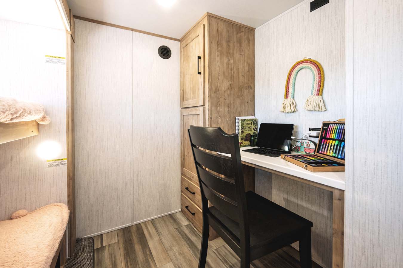 Work remote in privacy with this dedicated mid-bunk room.