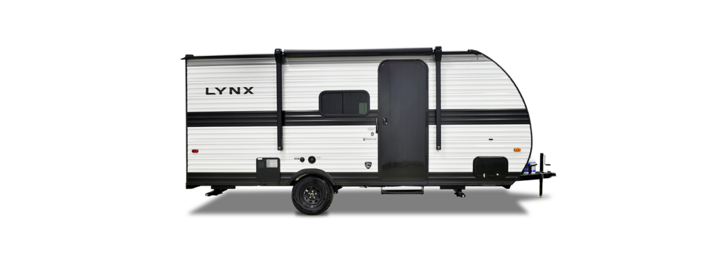 The image showcases a Heartland RV with a modern, sleek exterior designed for both style and durability. The RV features an aerodynamic front cap, bold graphic accents, and large tinted windows that provide a great view while maintaining privacy. A power awning extends from the side, offering an excellent outdoor living space. The sturdy entry steps make access easy, while the dual-axle setup ensures smooth towing. At the front, a power tongue jack and propane tanks add convenience for quick setup. The design focuses on blending functionality with aesthetics, making this RV a perfect companion for adventurous road trips.